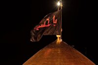 مراسم تعویض پرچم گنبد حرم سالار کربلا
